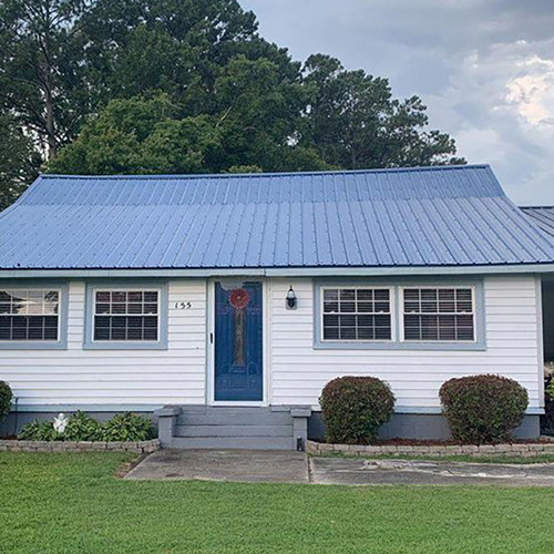Home with blue metal roof