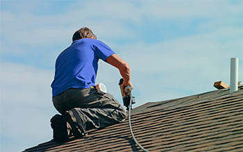 Man installing roof