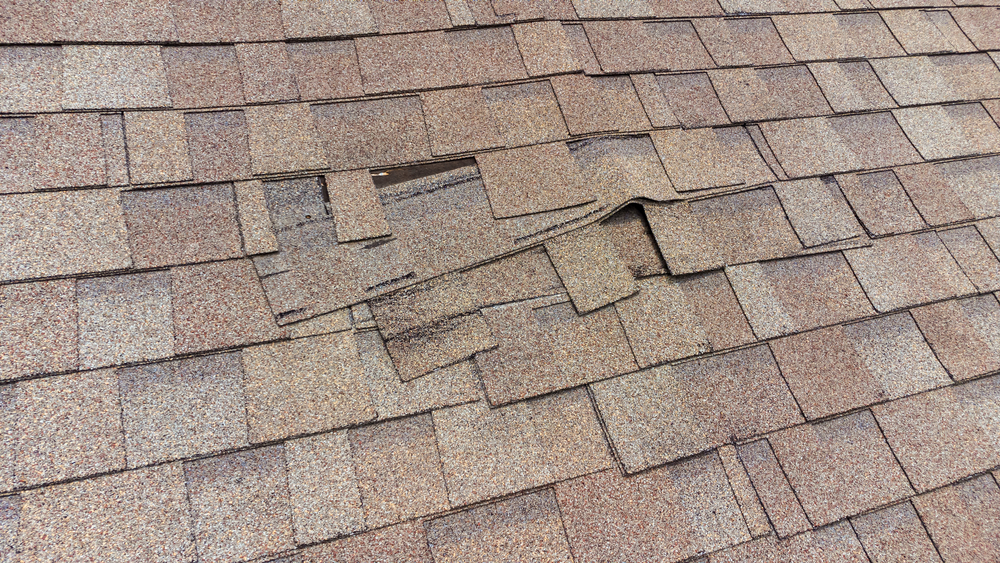 a roof with missing shingles