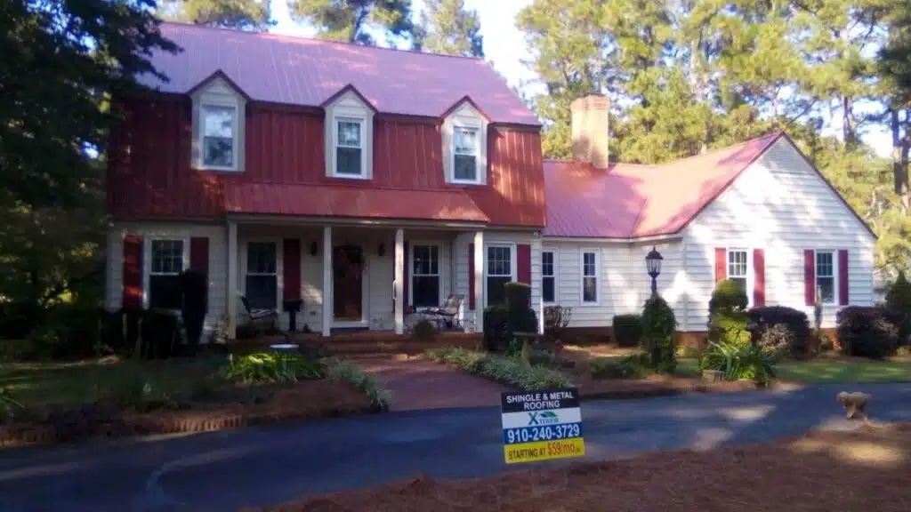 Red metal roof installed on a residential home by Xterior LLC